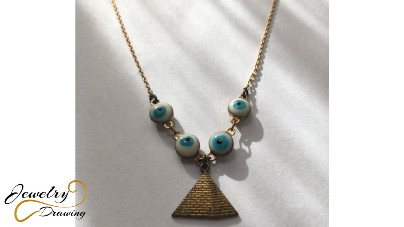 Gold Pyramid and eye shape object combination design pendant
