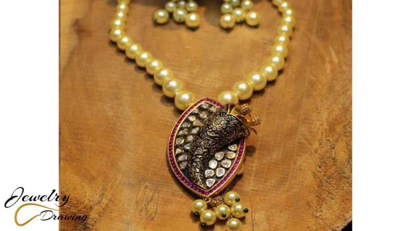 Goldish pearls and big drop leaf with unique design attachment, artificial jewellery