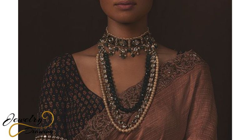 Green round object with drop shape and golden pearl decorative artificial necklace